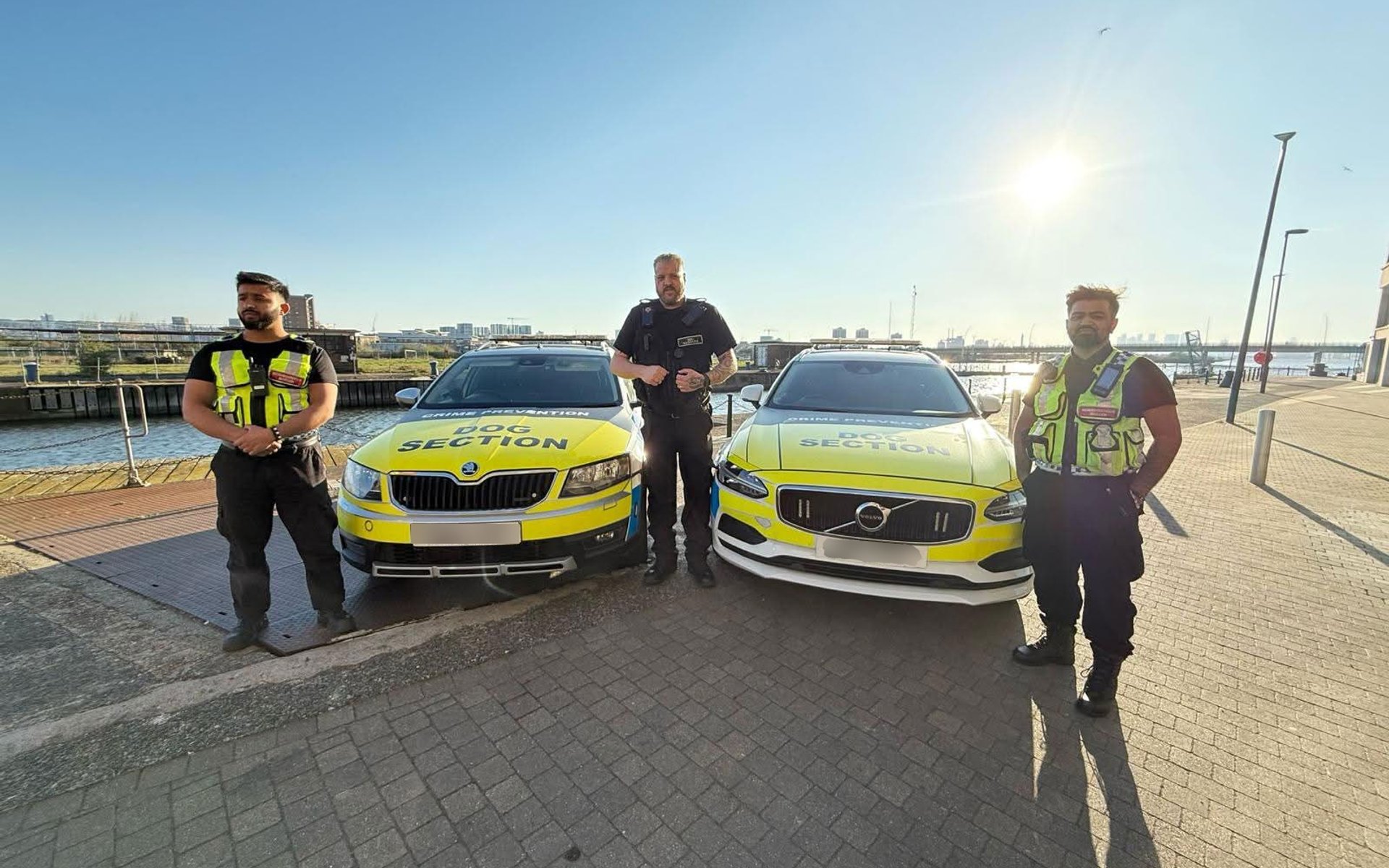 3 security guards in-front of their car